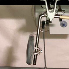 Knee ever releases presser foot	